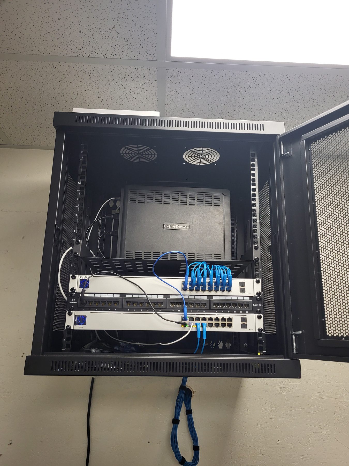 Finished commercial network rack installed by Magnuson Low Voltage Wiring